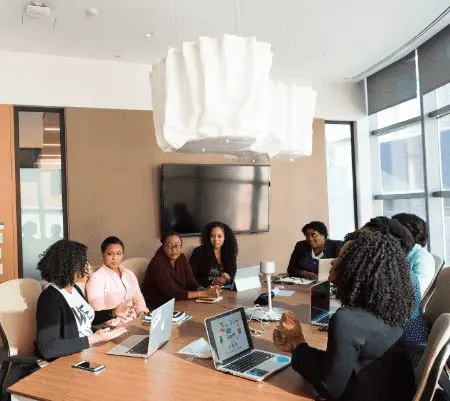 Office boardroom with a diverse group of team members having a meeting