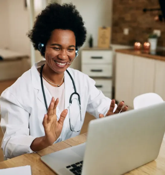 African-American female doctor on computer video call with member