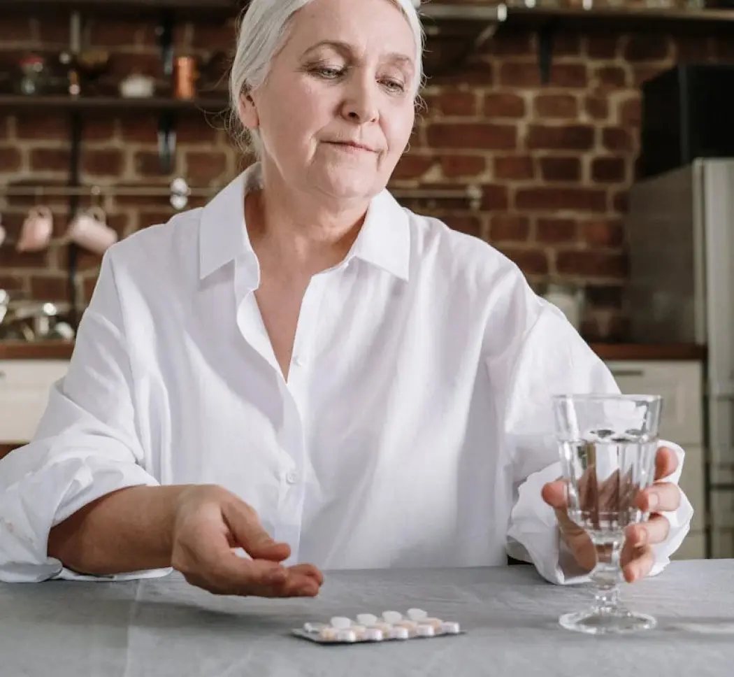 A woman taking medicine