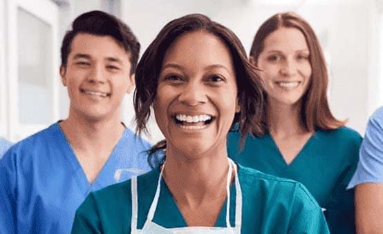 Group of happy doctors and nurses here to help you