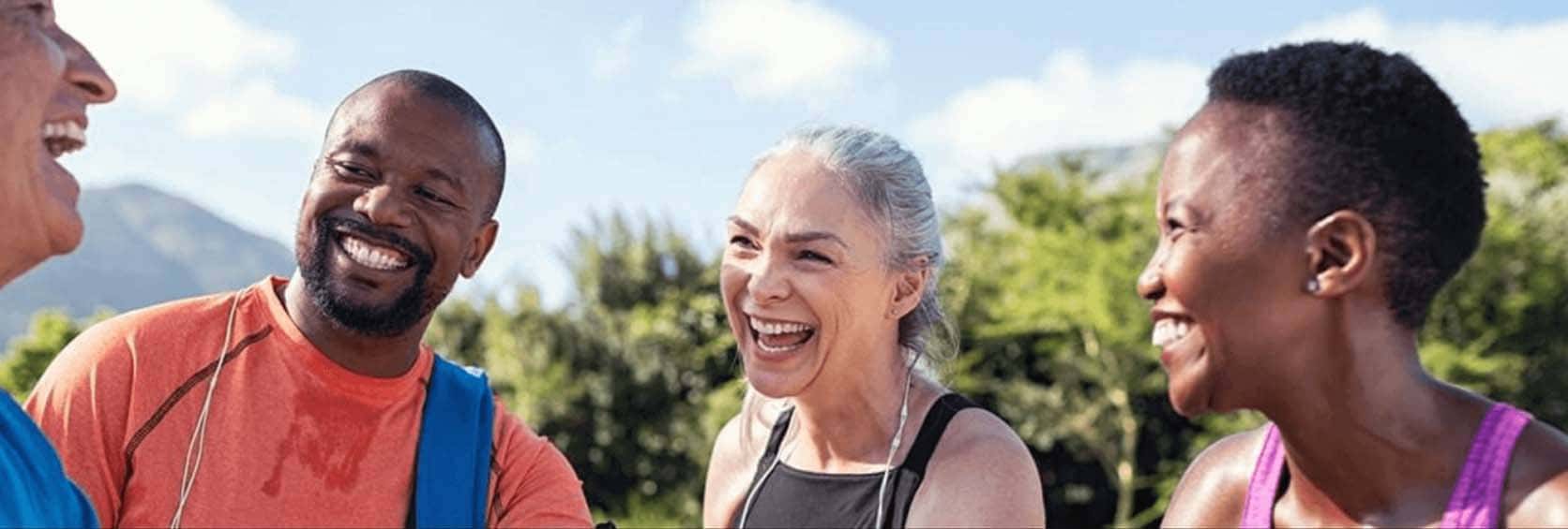 Group of diverse seniors at a park laughing Group of diverse seniors at a park laughing