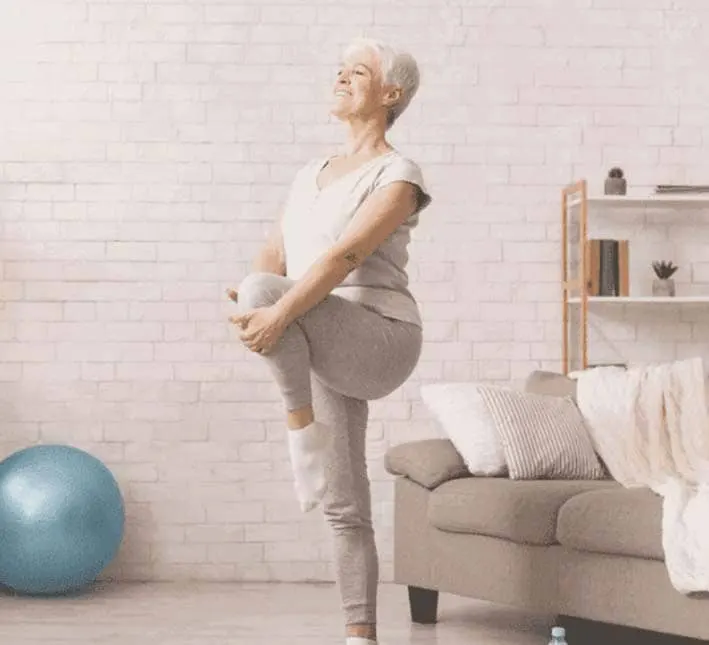 Senior woman doing yoga stretches