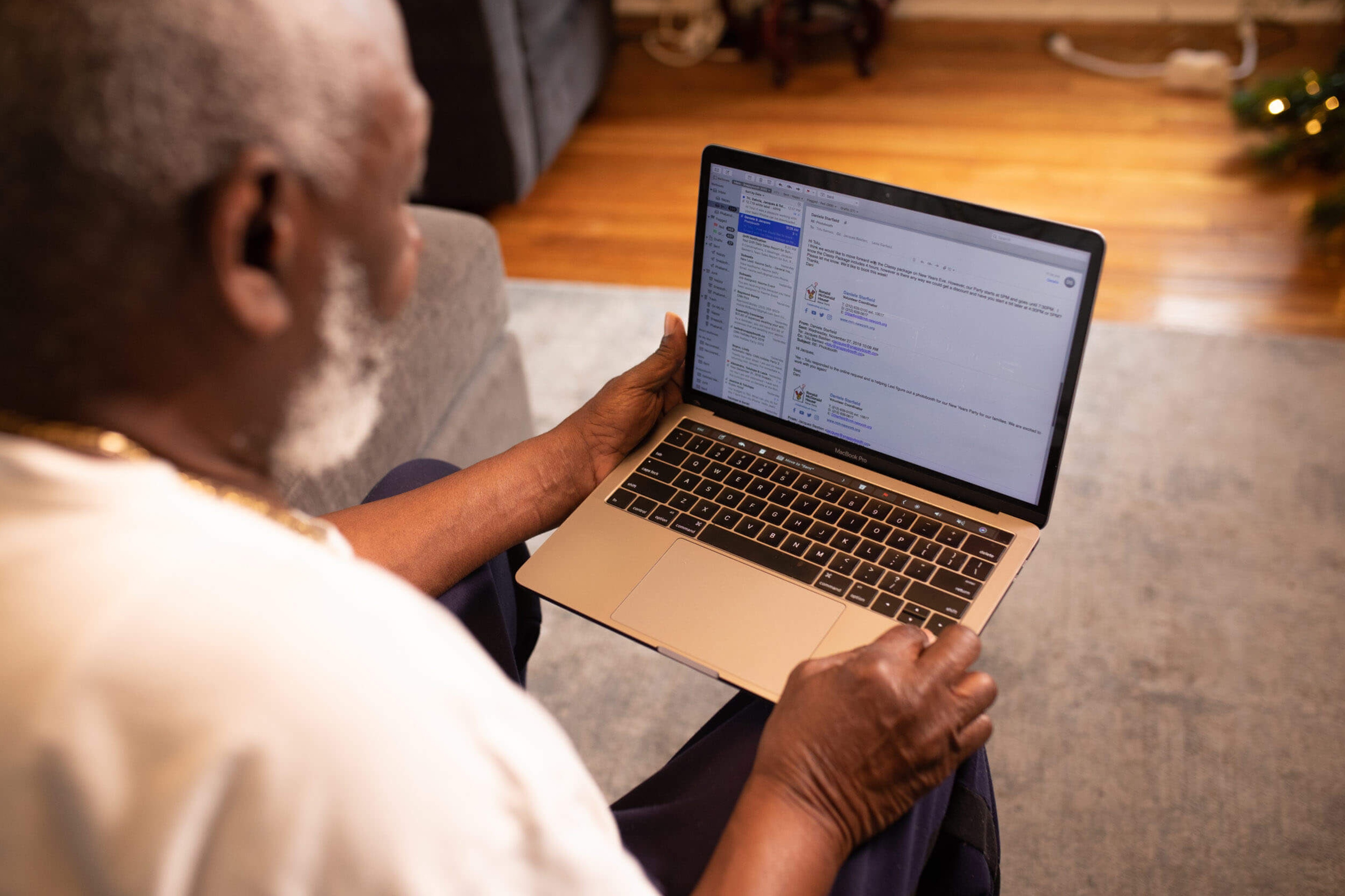 Senior African-American man on computer looking at documents